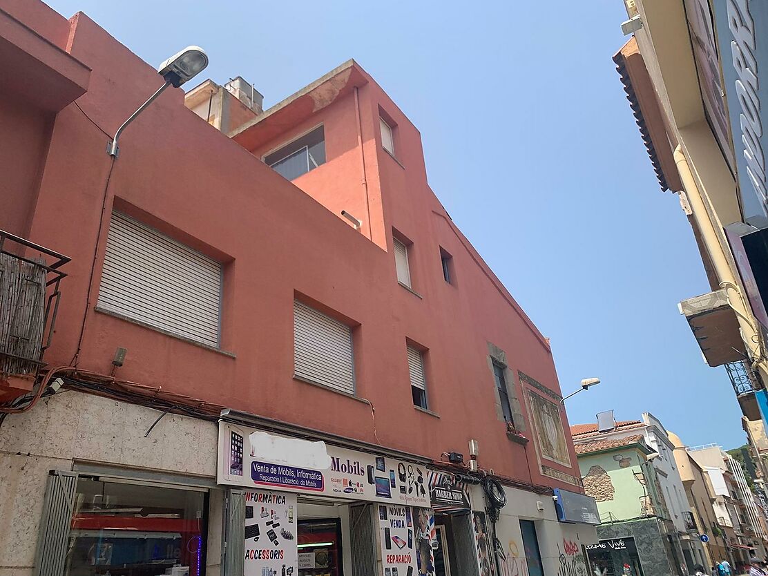 BUILDING LOCATED IN FRONT OF THE CHURCH OF MALGRAT DE MAR